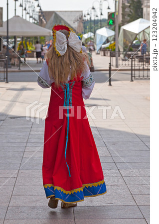 Young woman in traditionnal clothing from Omsk 123204942