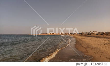 Gentle waves of red sea washing marsa alam beach in egypt at sunset Gentle waves of red sea washing marsa alam beach in egypt at sunset 123205166