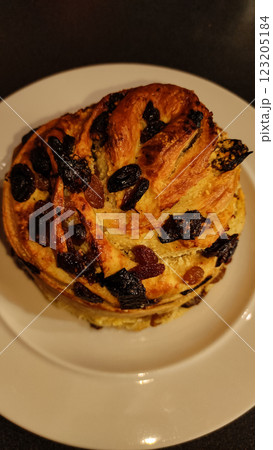 Traditional easter bread sprinkled with raisins, candied fruit, golden baked and showcasing festive holiday baking warmth copy space Traditional easter bread sprinkled with raisins, candied fruit, golden baked and showcasing festive holiday baking warmth copy space 123205184