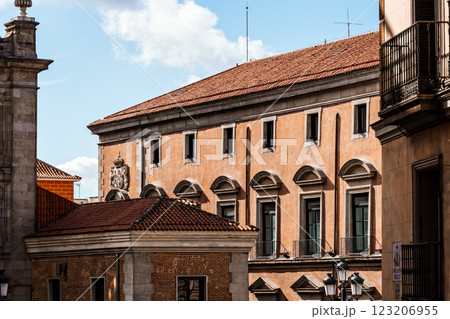 An elegant building in Madrid displays its classical facade with tiled roof and balconies. An elegant building in Madrid displays its classical facade with tiled roof and balconies. 123206955