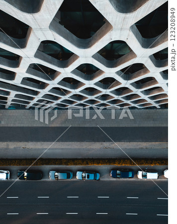 unique architectural exterior design of building viewed from above with cars parked along the street, big city life, Warsaw 123208949