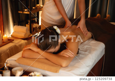 Caucasian woman customer enjoying relaxing anti-stress massage. Quiescent 123209738