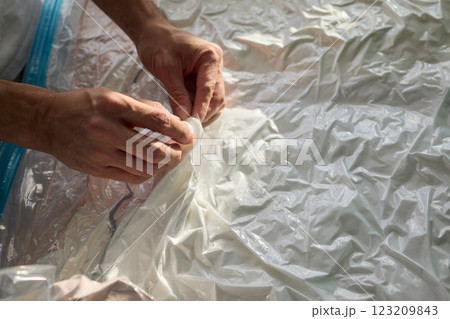 Vacuum Sealing Clothes Effectively for Storage, Preservation, and Space Saving Solutions Vacuum Sealing Clothes Effectively for Storage, Preservation, and Space Saving Solutions 123209843
