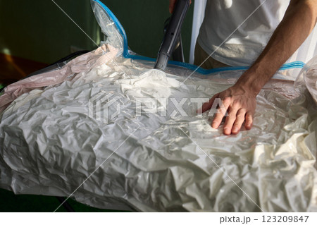 Vacuum Sealing Clothes Effectively for Storage, Preservation, and Space Saving Solutions Vacuum Sealing Clothes Effectively for Storage, Preservation, and Space Saving Solutions 123209847