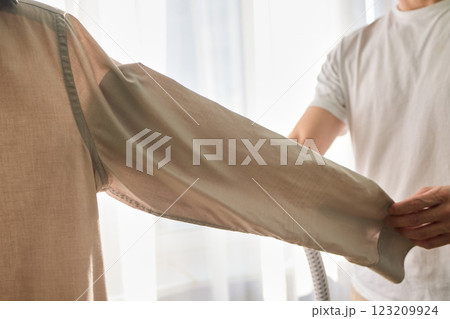 Steam cleaning your garments ensures a crisp, polished finish that enhances their appearance 123209924