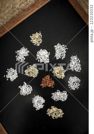 different kinds of organic asian rice variety grains on black background different kinds of organic asian rice variety grains on black background 123210332