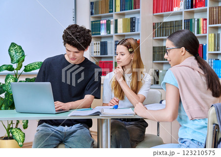Group of college students are studying in library class 123210575