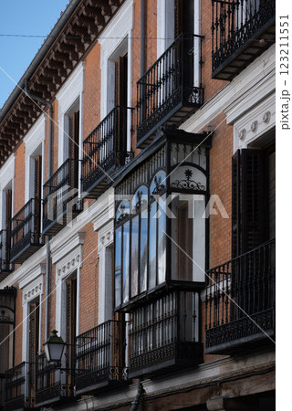 Beautifully designed balconies of a historic building in Madrid showcase intricate ironwork and classic architecture Beautifully designed balconies of a historic building in Madrid showcase intricate ironwork and classic architecture 123211551