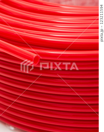 Red irrigation hose close-up. Background. Red irrigation hose close-up. Background. 123211594