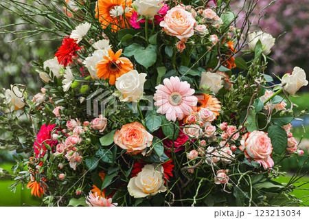 Bouquet of a beautiful flowers with gerbera and roses decoration background Flowers scape 123213034
