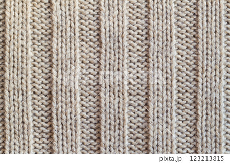 Creamy knitted wool warm clothes for the winter fabric texture background Creamy knitted wool warm clothes for the winter fabric texture background 123213815