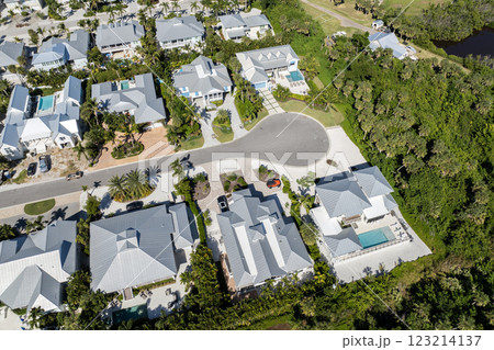 Boca Grande, Florida. Expensive waterfront houses between green palm trees. Premium housing development in the USA Boca Grande, Florida. Expensive waterfront houses between green palm trees. Premium housing development in the USA 123214137