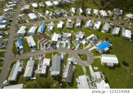 Badly damaged mobile homes after hurricane Ian in Florida residential area. Consequences of natural disaster 123214368