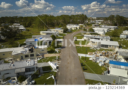 Badly damaged mobile homes after hurricane Ian in Florida residential area. Consequences of natural disaster 123214369