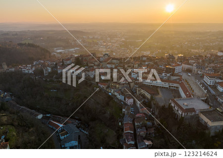 Aerial view of dense historic center of Thiers town in Puy-de-Dome department, Auvergne-Rhone-Alpes region in France. Rooftops of old buildings and narrow streets at sunset 123214624