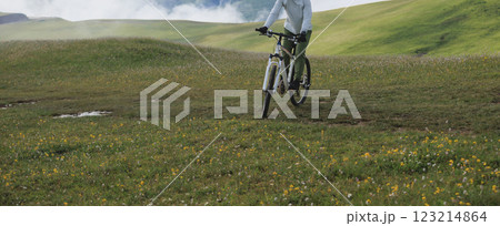 Riding mountain bike on beautiful mountain top 123214864