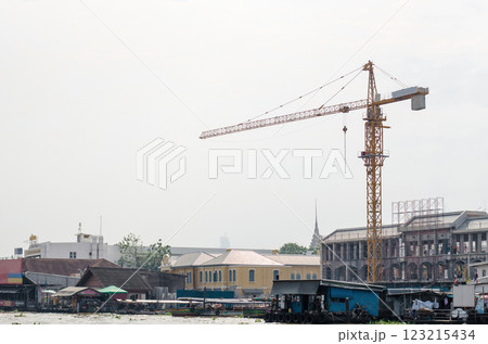 Construction site with crane and river view. Construction site with crane and river view. 123215434