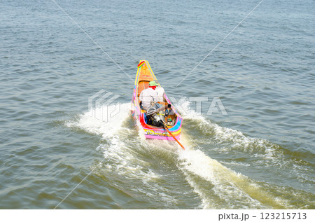 Colorful boat sailing on water surface 123215713