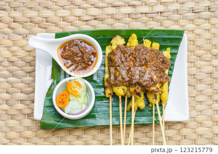 Satay with peanut sauce and cucumber salad, Bangkok, Thailand Satay with peanut sauce and cucumber salad, Bangkok, Thailand 123215779