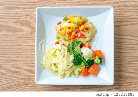 Delicious meal with chicken, pasta, and vegetables Delicious meal with chicken, pasta, and vegetables 123215889