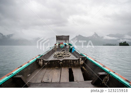 Boat view on calm water with cloudy sky at Khao Sok national park at Surat Thani, Thailand Boat view on calm water with cloudy sky at Khao Sok national park at Surat Thani, Thailand 123215918