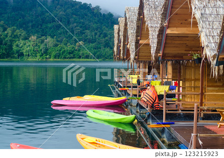 Colorful kayaks by floating huts on a tranquil lake at Khao Sok national park at Surat Thani, Thailand 123215923