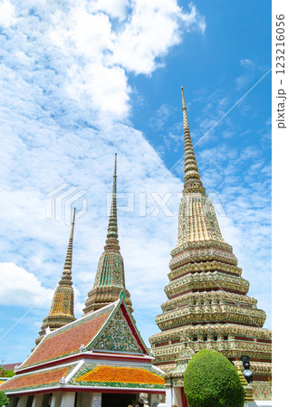 Buddhist pagodas under a bright blue sky at Wat Pho Bangkok Thailand Buddhist pagodas under a bright blue sky at Wat Pho Bangkok Thailand 123216056