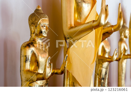 Golden Buddha statues in serene pose at Wat Pho Bangkok Thailand 123216061