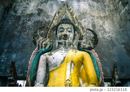 Ancient Buddha statue in a dilapidated structure in Sangklaburi Kanchanaburi Thailand Ancient Buddha statue in a dilapidated structure in Sangklaburi Kanchanaburi Thailand 123216118