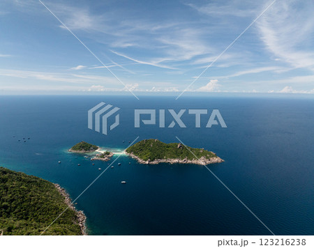 Tropical islands with lush greenery and turquoise waters under a clear blue sky. Koh Tao, Thailand. Tropical islands with lush greenery and turquoise waters under a clear blue sky. Koh Tao, Thailand. 123216238