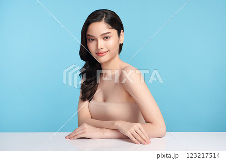 Beautiful Young transgender woman with clean fresh skin on blue background, Face care, Facial treatment, Cosmetology, beauty and spa, transgender women portrait. Beautiful Young transgender woman with clean fresh skin on blue background, Face care, Facial treatment, Cosmetology, beauty and spa, transgender women portrait. 123217514