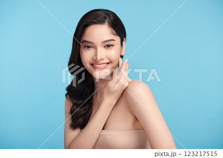 Beautiful Young transgender woman with clean fresh skin on blue background, Face care, Facial treatment, Cosmetology, beauty and spa, transgender women portrait. 123217515