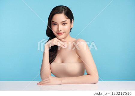 Beautiful Young transgender woman with clean fresh skin on blue background, Face care, Facial treatment, Cosmetology, beauty and spa, transgender women portrait. Beautiful Young transgender woman with clean fresh skin on blue background, Face care, Facial treatment, Cosmetology, beauty and spa, transgender women portrait. 123217516