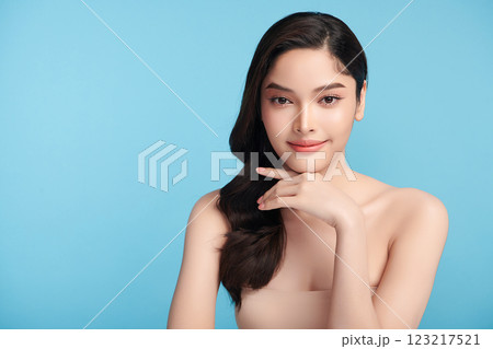 Beautiful Young transgender woman with clean fresh skin on blue background, Face care, Facial treatment, Cosmetology, beauty and spa, transgender women portrait. Beautiful Young transgender woman with clean fresh skin on blue background, Face care, Facial treatment, Cosmetology, beauty and spa, transgender women portrait. 123217521