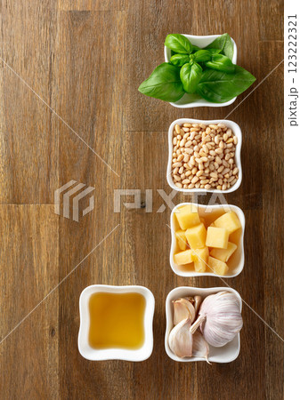 Ingredients for traditional Italian pesto recipe on a wooden background. 123222321