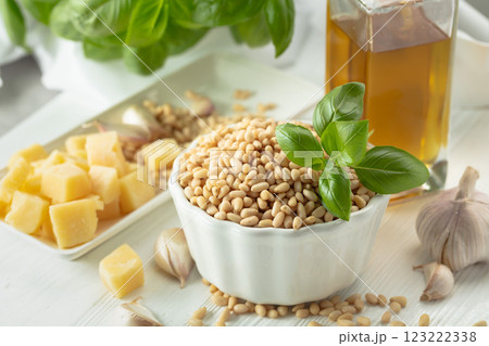 Ingredients for making Pesto sauce on a white wooden table. 123222338
