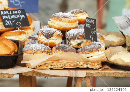 Bakery stall with poppy seed doughnuts on display Bakery stall with poppy seed doughnuts on display 123224593