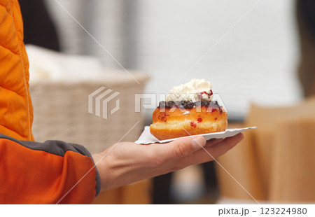 Buying Bavarian sweet dessert at farmers market Buying Bavarian sweet dessert at farmers market 123224980