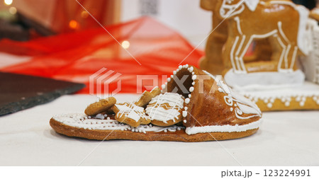 A slipper with a load of small cookies, made from edible gingerbread  123224991