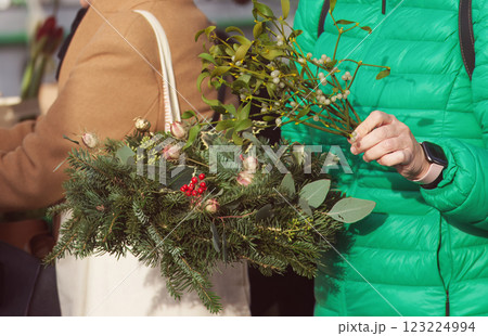 Shopping for advent wreaths and floral decorations for Christmas Shopping for advent wreaths and floral decorations for Christmas 123224994