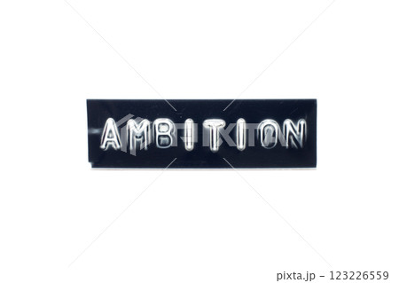 Embossed letter in word ambition on black banner with white background Embossed letter in word ambition on black banner with white background 123226559