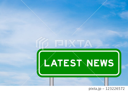 Green color transportation sign with word latest news on blue sky with white cloud background 123226572