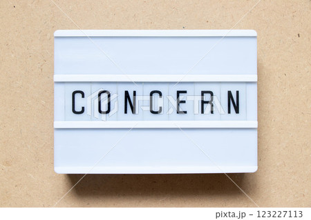 Lightbox with word concern on wood background Lightbox with word concern on wood background 123227113