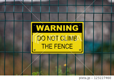 Warning - Do not climb the fence 123227460