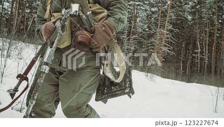 Usa Army Soldiers Of World War Ii. Re-enactors Dressed As American Infantry Soldier Going Through Forest Road With Mortar. Two Usa Soldiers Marching By Country Road. Usa Army Soldiers Of World War Ii. Re-enactors Dressed As American Infantry Soldier Going Through Forest Road With Mortar. Two Usa Soldiers Marching By Country Road. 123227674