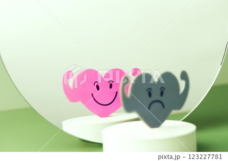 Mental Health Concept. Complexity of Deepest Mind and the Personality to Expressed Different Characteristics in Public. a Sad Face Reflects a Smiling face on another side of the Mirror. Bipolar 123227781