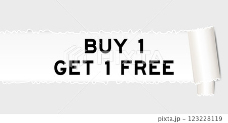 Ripped gray paper background that have word buy 1 get 1 free under torn part 123228119