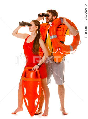 Lifeguards with rescue ring buoy and life vest. Lifeguards with rescue ring buoy and life vest. 123228417