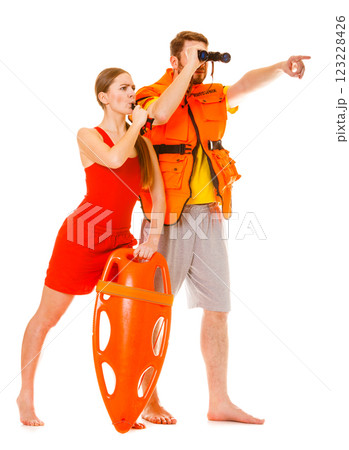 Lifeguards in life vest with rescue buoy whistling 123228426