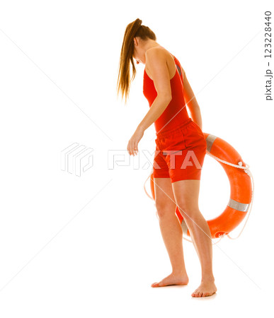 Lifeguard on duty with ring buoy lifebuoy. Lifeguard on duty with ring buoy lifebuoy. 123228440